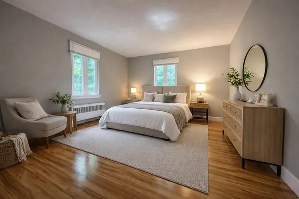 a bedroom with a bed and window