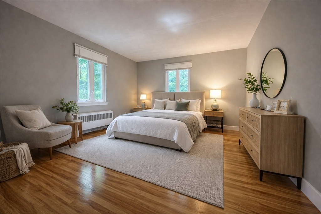 110 Craftsland Road, Unit 110 Newton, MA 02467 - Photo 6 of 14 a bedroom with bed and a couch