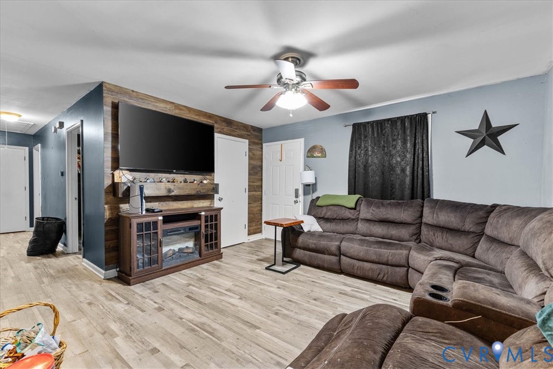 2224 Butler Branch Road Petersburg, VA 23805 - Photo 16 of 24 a living room with furniture and a flat screen tv