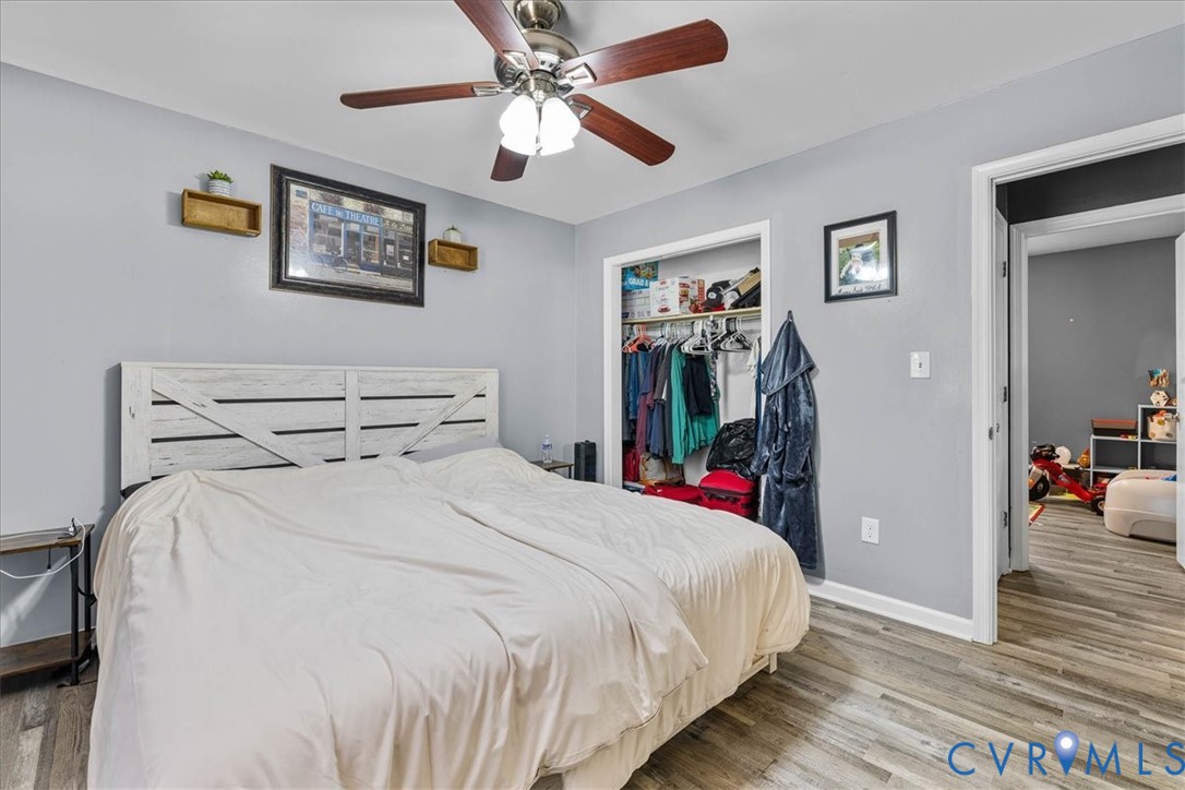 2224 Butler Branch Road Petersburg, VA 23805 - Photo 2 of 24 a bed room with a bed and a chandelier