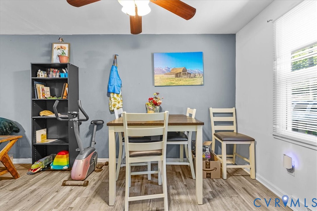 2224 Butler Branch Road Petersburg, VA 23805 - Photo 22 of 24 a view of a dining room with furniture wooden floor and a window