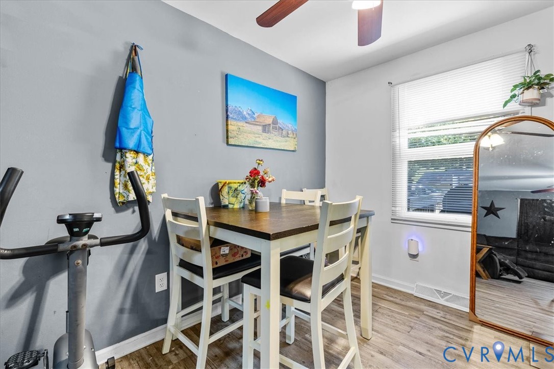 2224 Butler Branch Road Petersburg, VA 23805 - Photo 24 of 24 a view of a dining room with furniture wooden floor and a chandelier