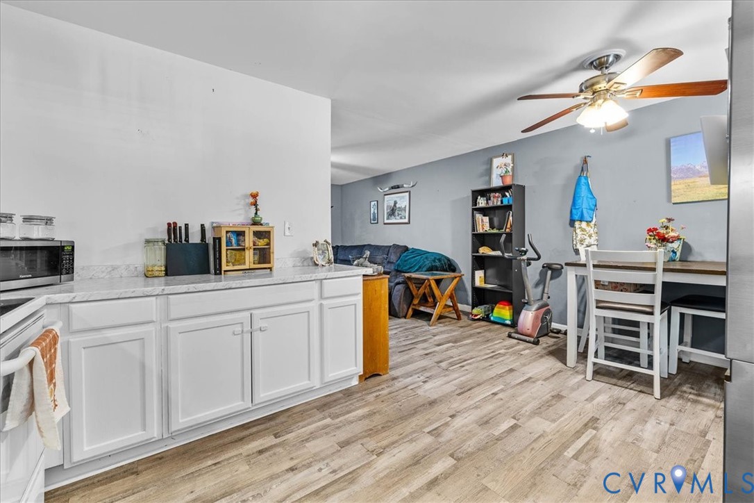 2224 Butler Branch Road Petersburg, VA 23805 - Photo 9 of 24 a bedroom with furniture and a wooden floor
