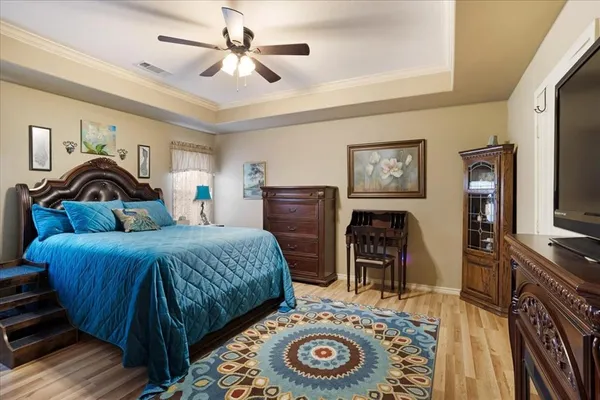 a bedroom with a bed and a fireplace