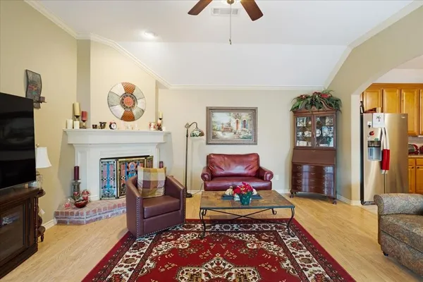 a living room with furniture and a fireplace