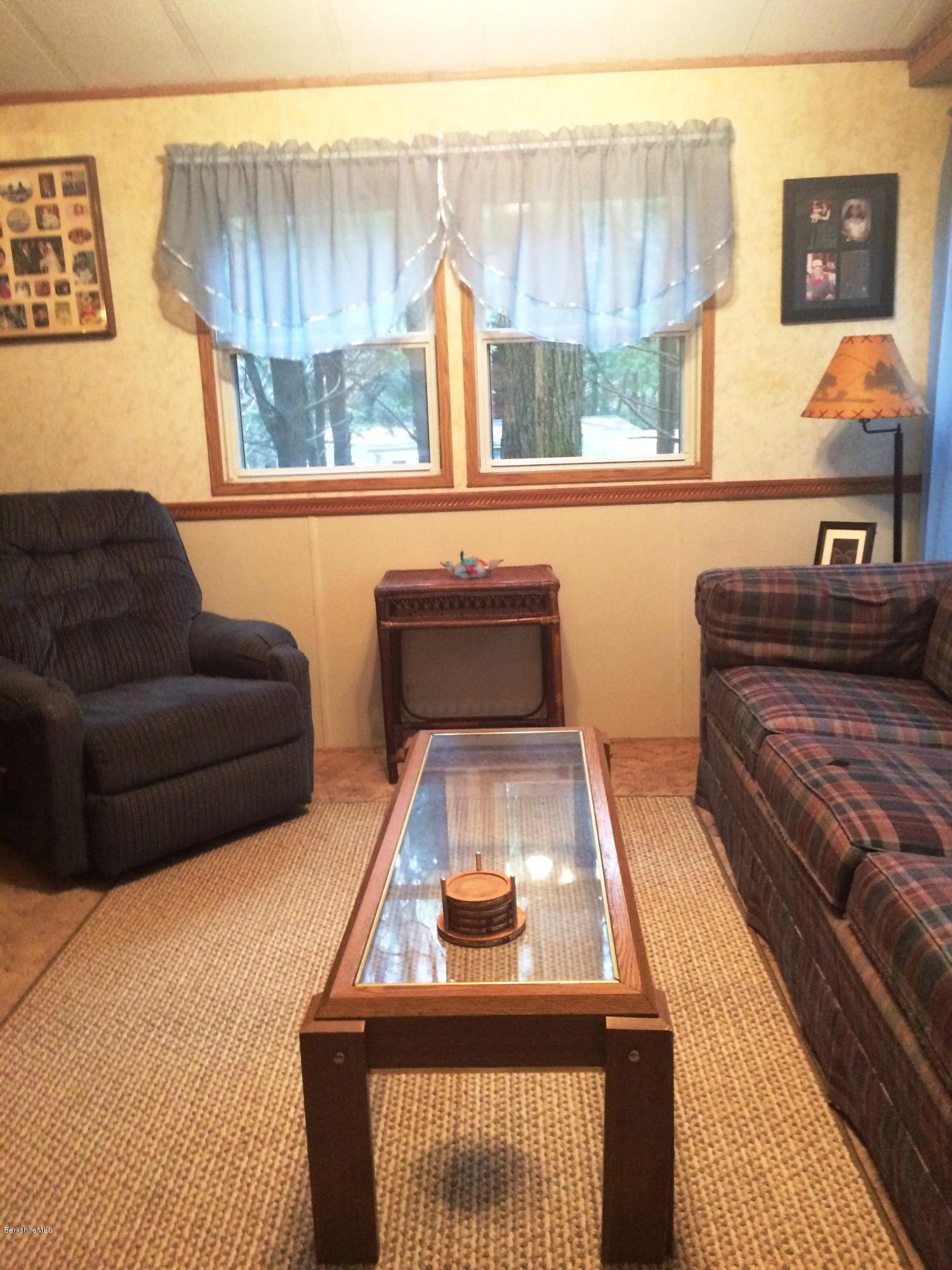 5-10 759 North Main Road Otis, MA 01253 - Photo 8 of 18 a living room with furniture and a window