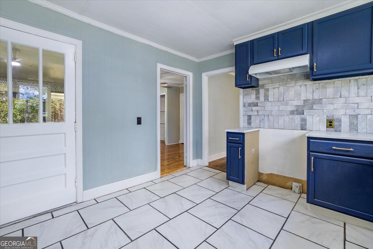 360 North Lewis Street Metter, GA 30439 - Photo 21 of 39 a kitchen with a cabinets and a stove top oven