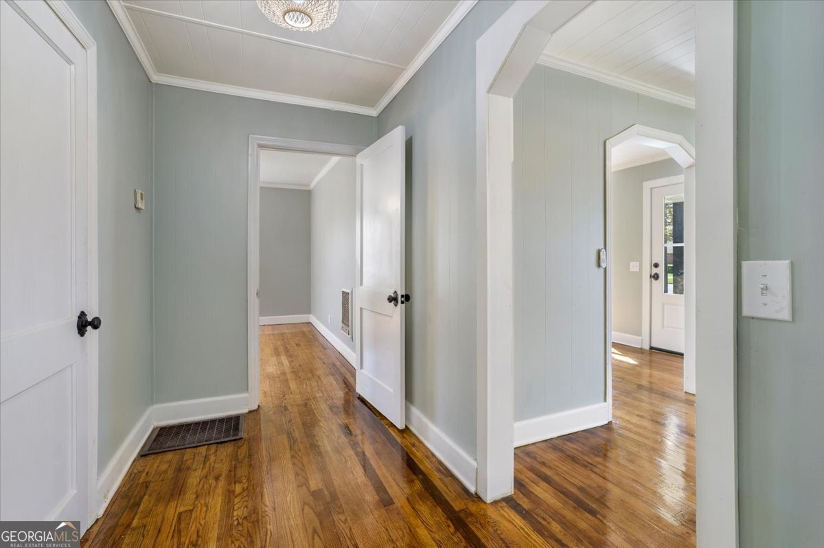 360 North Lewis Street Metter, GA 30439 - Photo 24 of 39 a view of a hallway with wooden floor