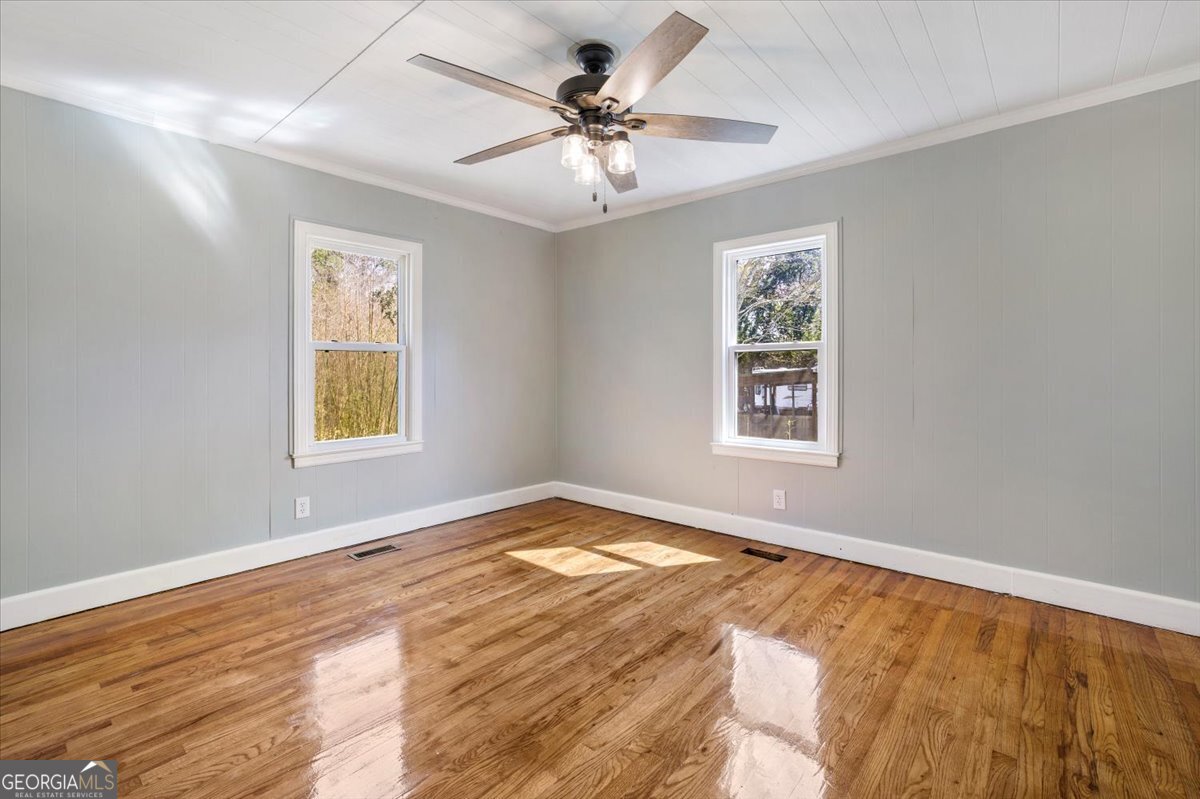360 North Lewis Street Metter, GA 30439 - Photo 25 of 39 a view of an empty room with window