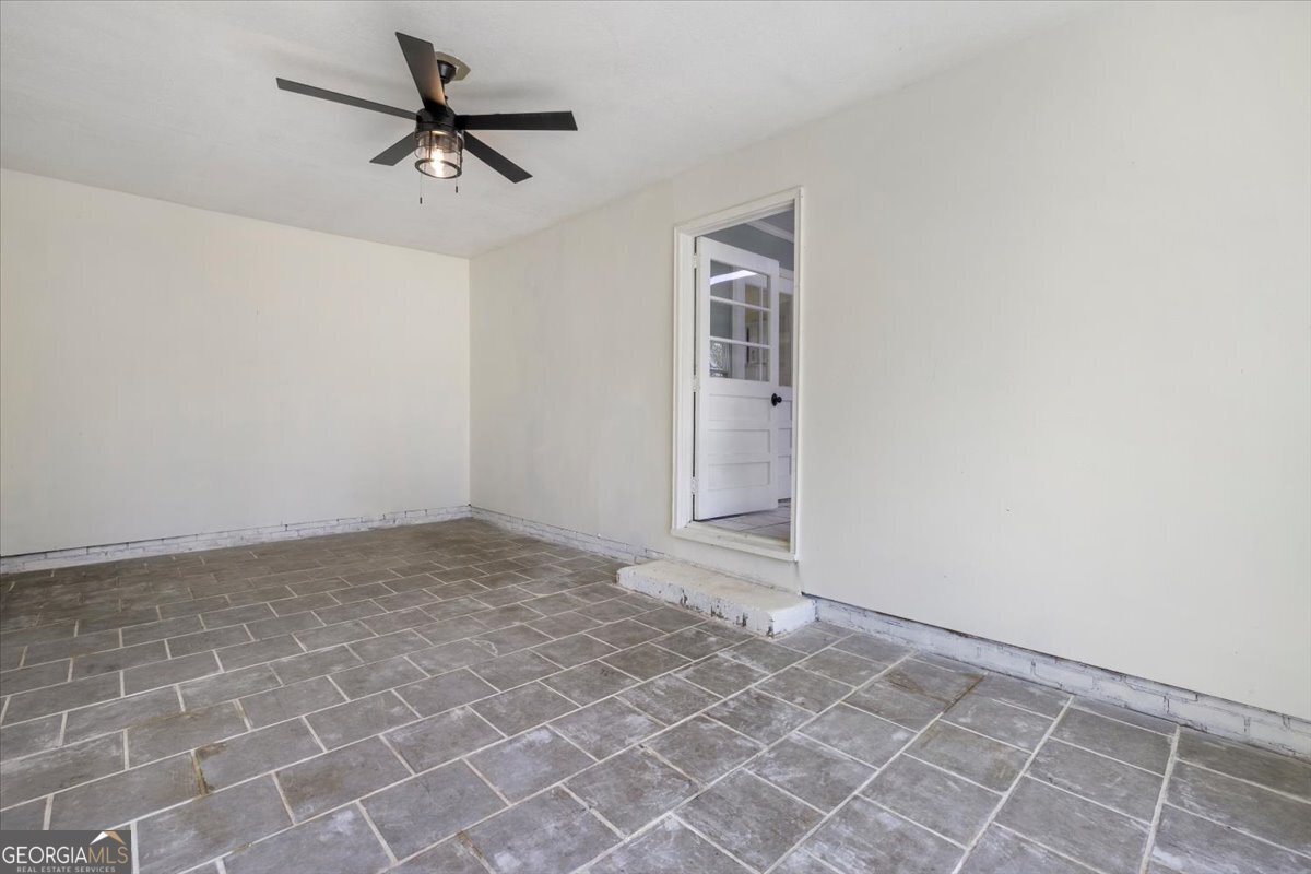 360 North Lewis Street Metter, GA 30439 - Photo 31 of 39 a view of a livingroom with a ceiling fan and window