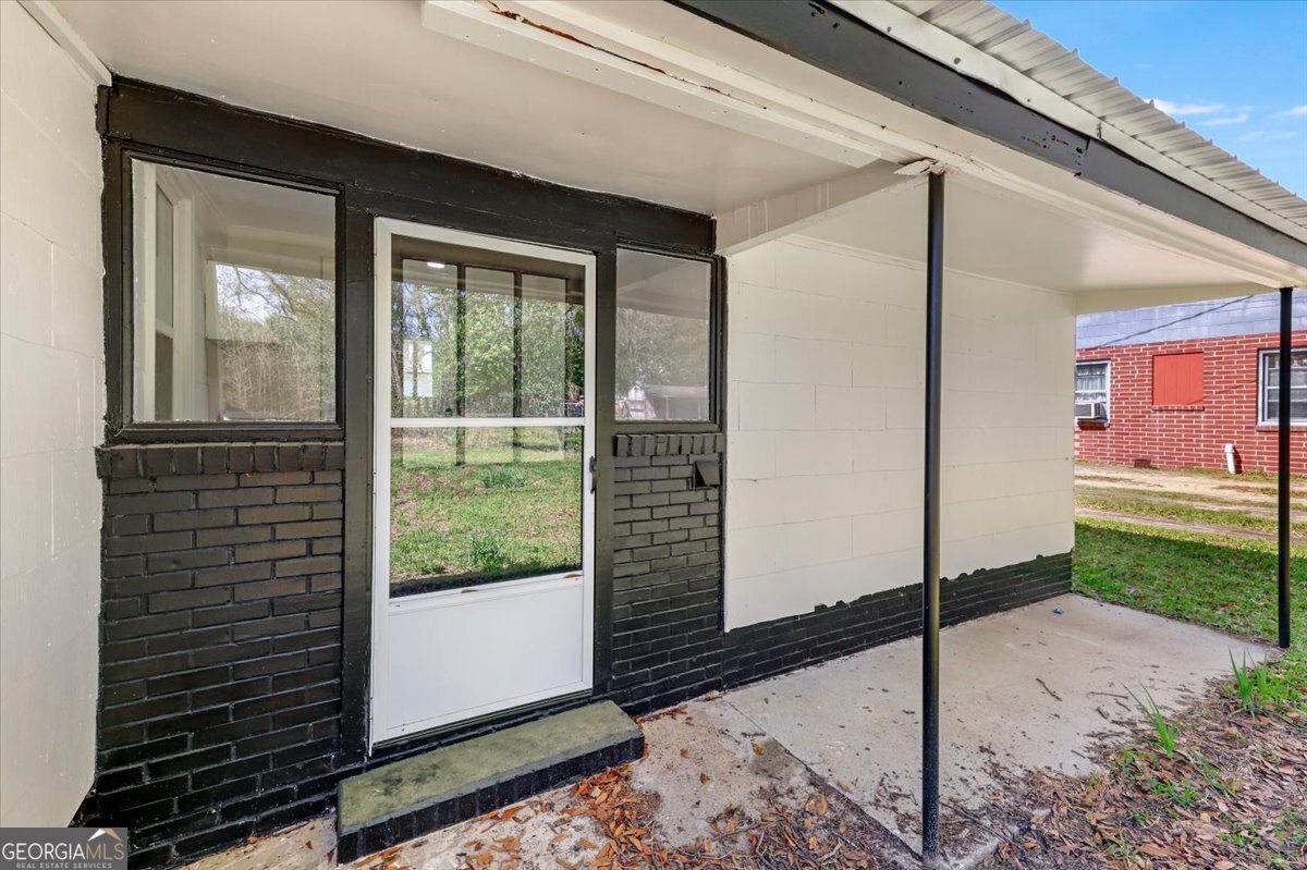 360 North Lewis Street Metter, GA 30439 - Photo 39 of 39 a view of a door and a window