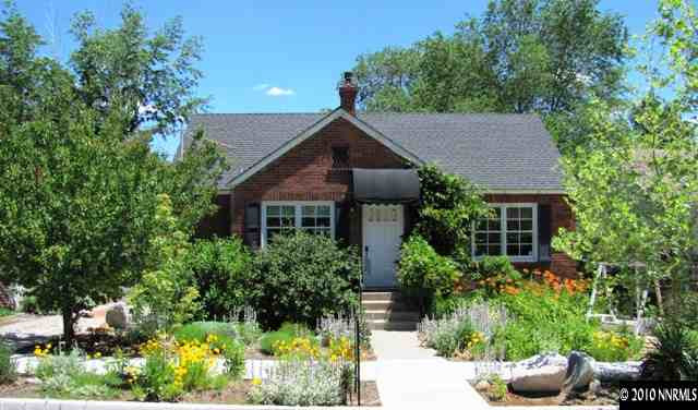 1260 Patrick Avenue Reno, NV 89509 - Photo 1 of 9 a front view of a house with a yard and potted plants