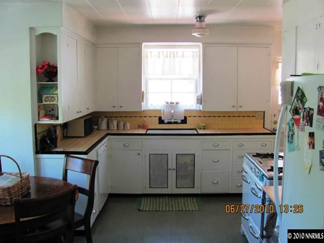 1260 Patrick Avenue Reno, NV 89509 - Photo 4 of 9 a kitchen with a sink cabinets and window