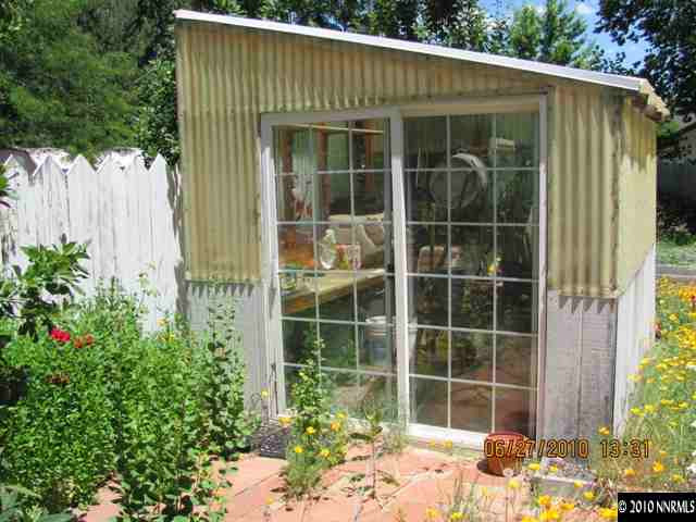 1260 Patrick Avenue Reno, NV 89509 - Photo 7 of 9 a view of a backyard with a large window and plants