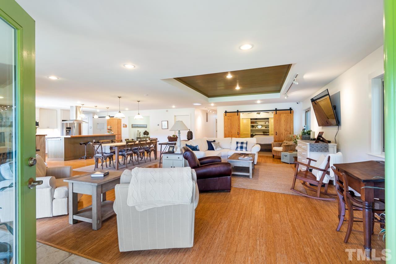 2639 Umstead Road Durham, NC 27712 - Photo 11 of 42 a living room with lots of furniture and a flat screen tv