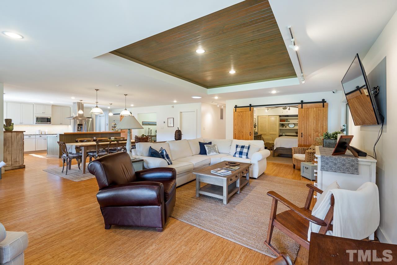 2639 Umstead Road Durham, NC 27712 - Photo 12 of 42 a living room with furniture and a flat screen tv