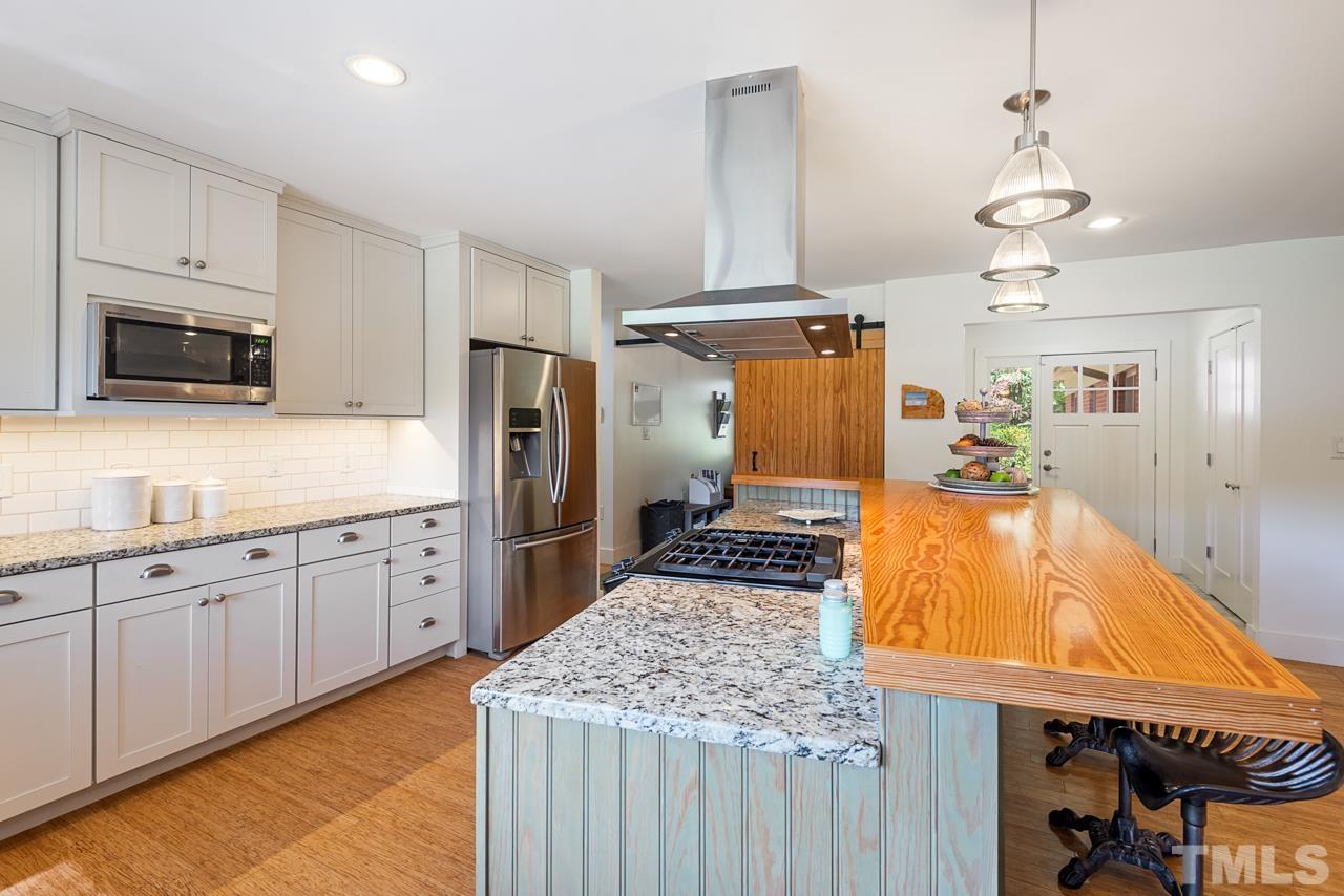 2639 Umstead Road Durham, NC 27712 - Photo 18 of 42 a kitchen with cabinets and window