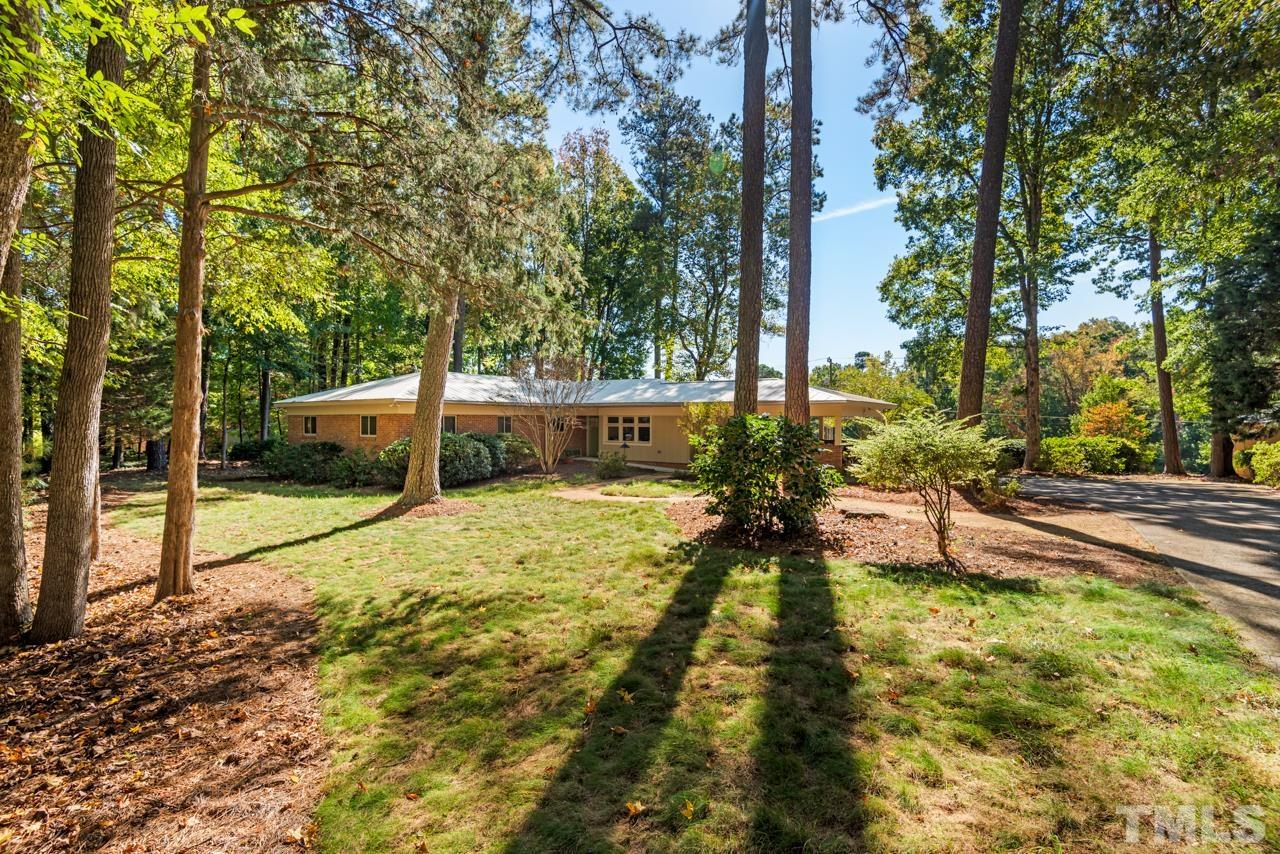 2639 Umstead Road Durham, NC 27712 - Photo 2 of 42 a view of a yard with large trees