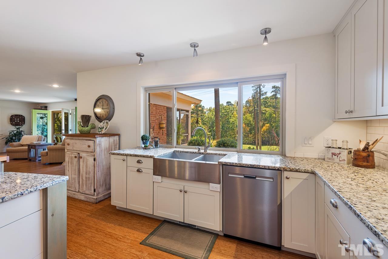 2639 Umstead Road Durham, NC 27712 - Photo 21 of 42 a kitchen with sink stove and cabinets