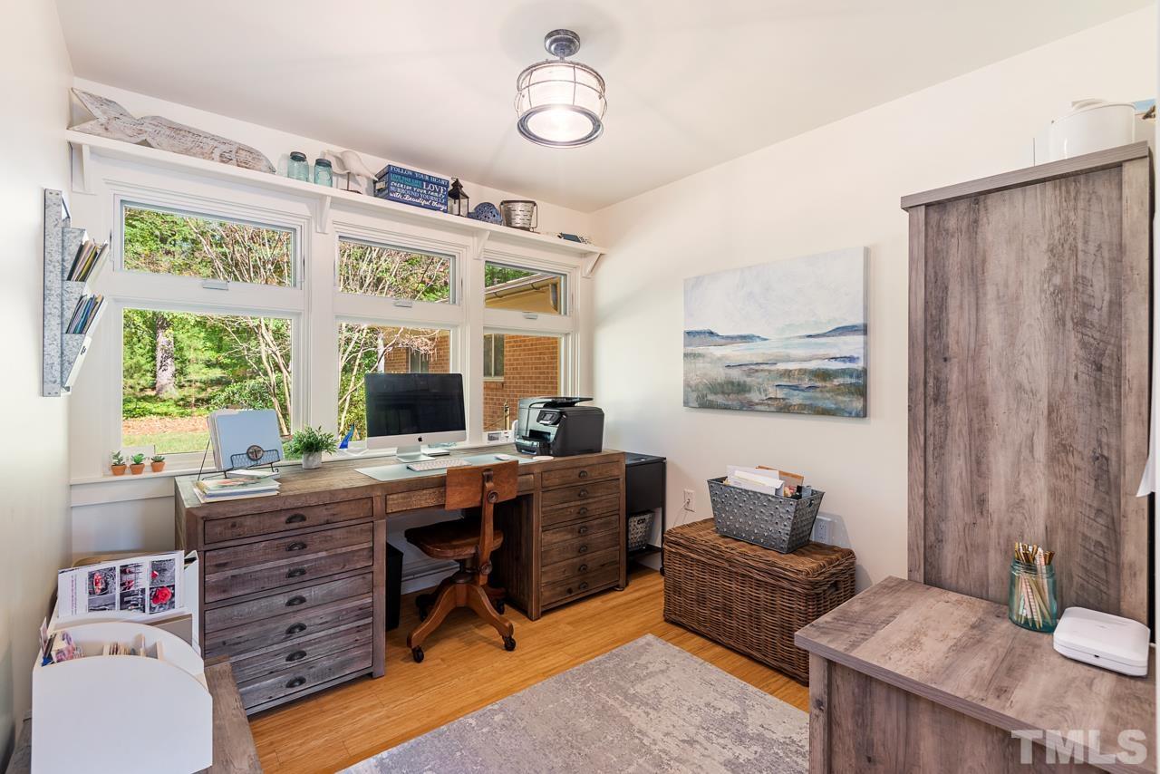 2639 Umstead Road Durham, NC 27712 - Photo 24 of 42 a view of a workspace with furniture and a window
