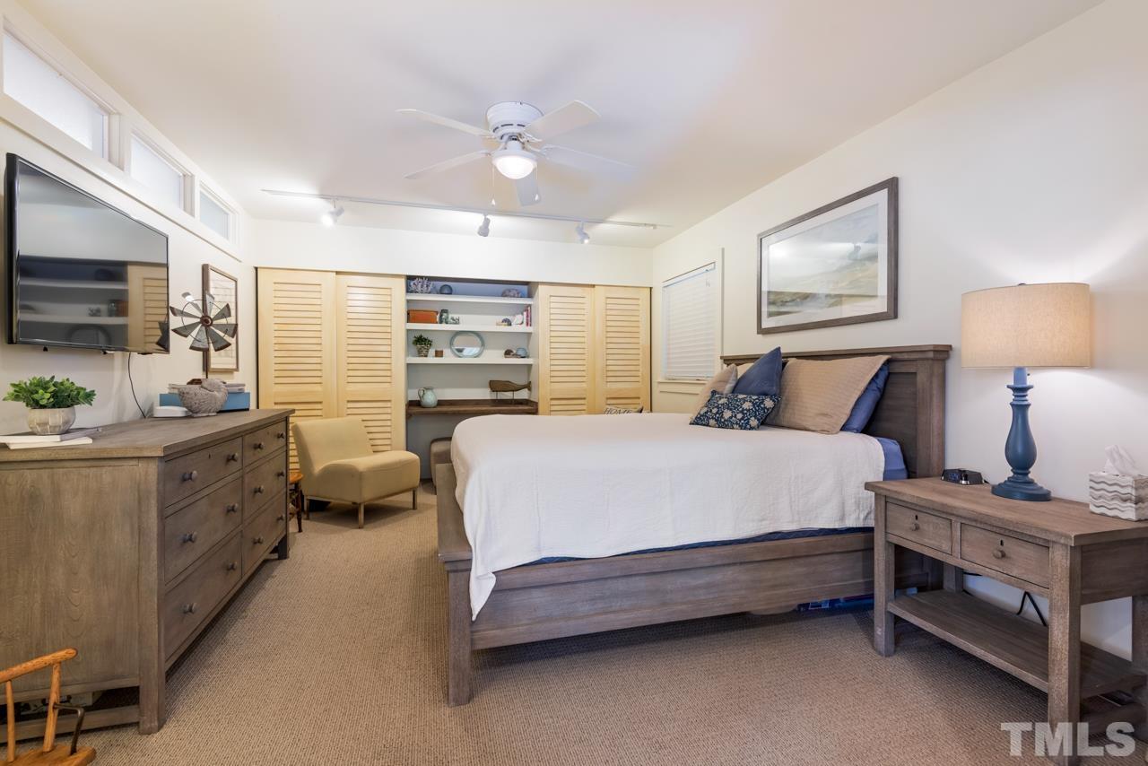 2639 Umstead Road Durham, NC 27712 - Photo 25 of 42 a spacious bedroom with a bed and dresser