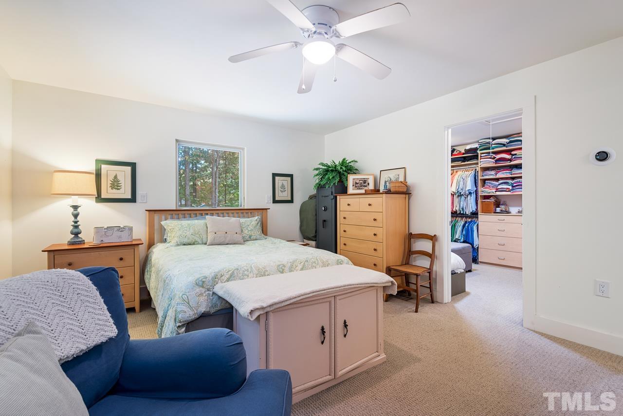 2639 Umstead Road Durham, NC 27712 - Photo 27 of 42 a bed room with a bed and a book shelf
