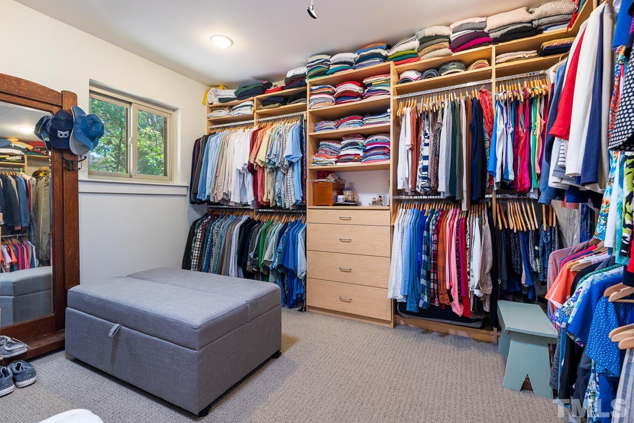 2639 Umstead Road Durham, NC 27712 - Photo 30 of 42 a view of walk in closet with clothes and shoes