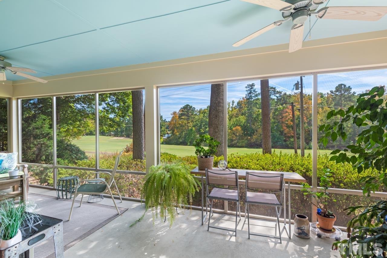 2639 Umstead Road Durham, NC 27712 - Photo 3 of 42 a view of a patio with a table chairs and a backyard