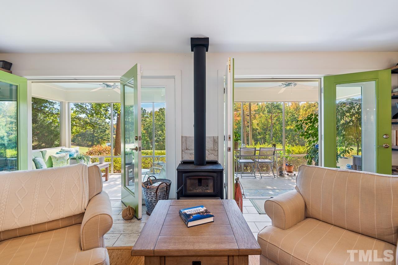 2639 Umstead Road Durham, NC 27712 - Photo 33 of 42 a living room with furniture and large windows