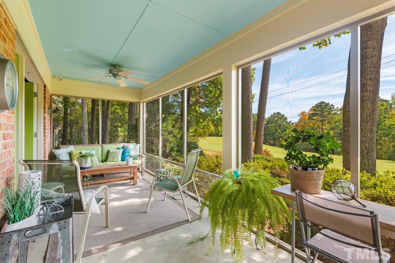 2639 Umstead Road Durham, NC 27712 - Photo 35 of 42 a living room with furniture and floor to ceiling windows