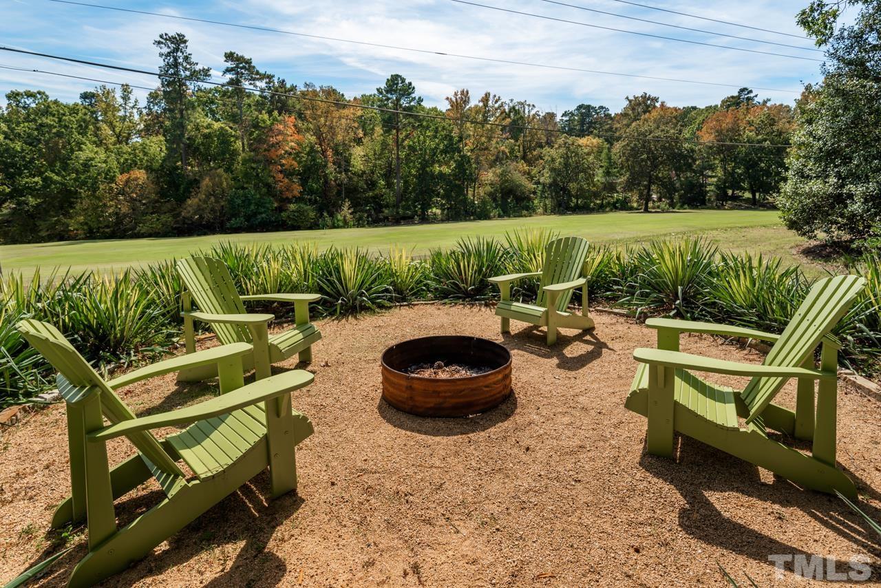 2639 Umstead Road Durham, NC 27712 - Photo 37 of 42 a backyard of a house with lots of green space and outdoor seating