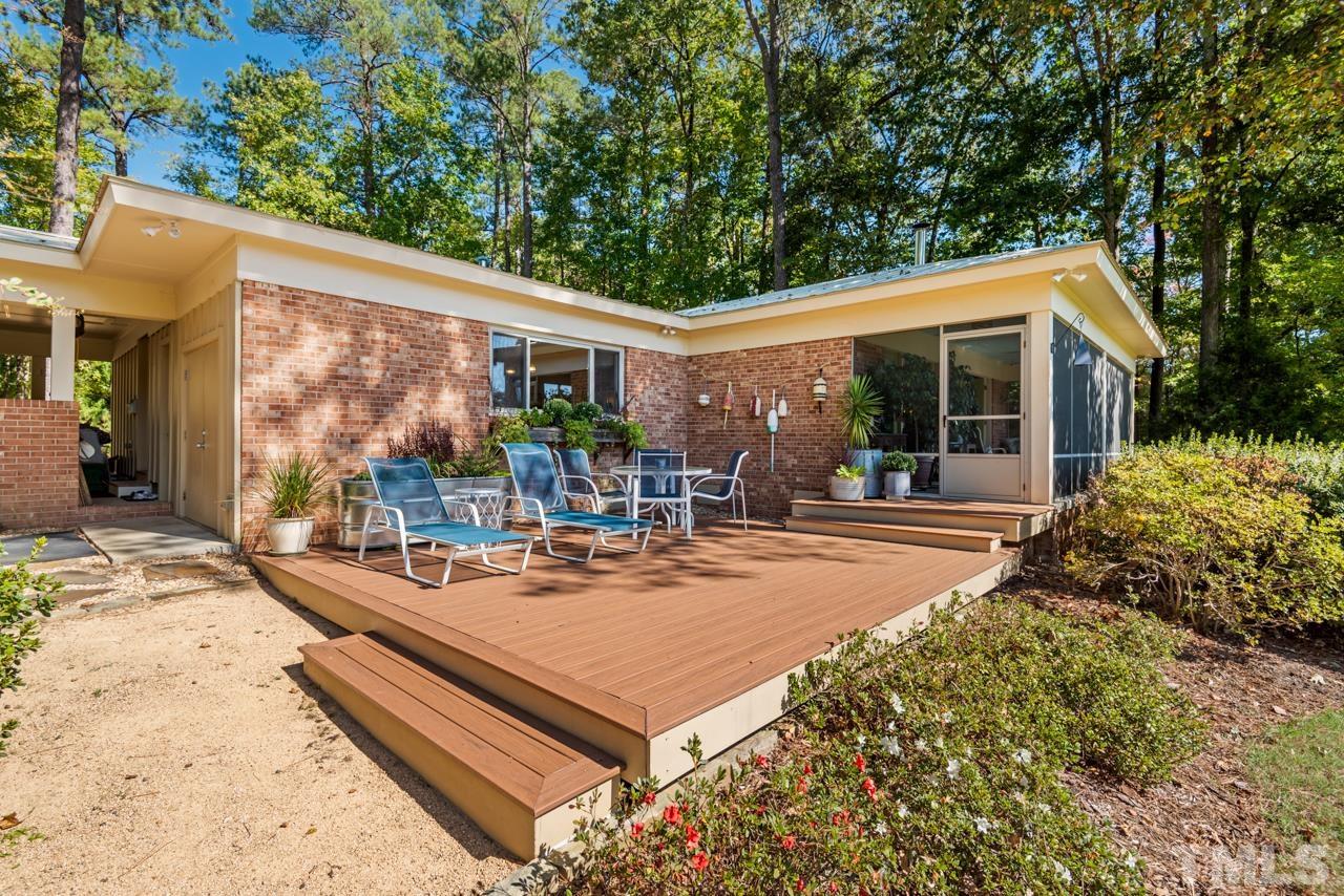 2639 Umstead Road Durham, NC 27712 - Photo 38 of 42 a view of a house with backyard porch and sitting area