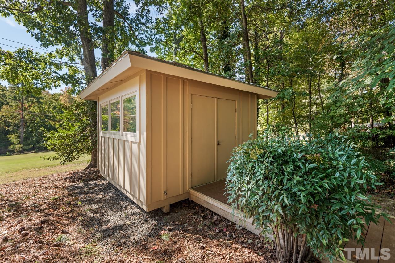 2639 Umstead Road Durham, NC 27712 - Photo 41 of 42 a backyard of a house with lots of green space