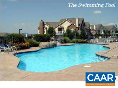 825 Beverley Drive, Unit 2 Charlottesville, VA 22911 - Photo 2 of 3 a front view of a house with swimming pool having outdoor seating