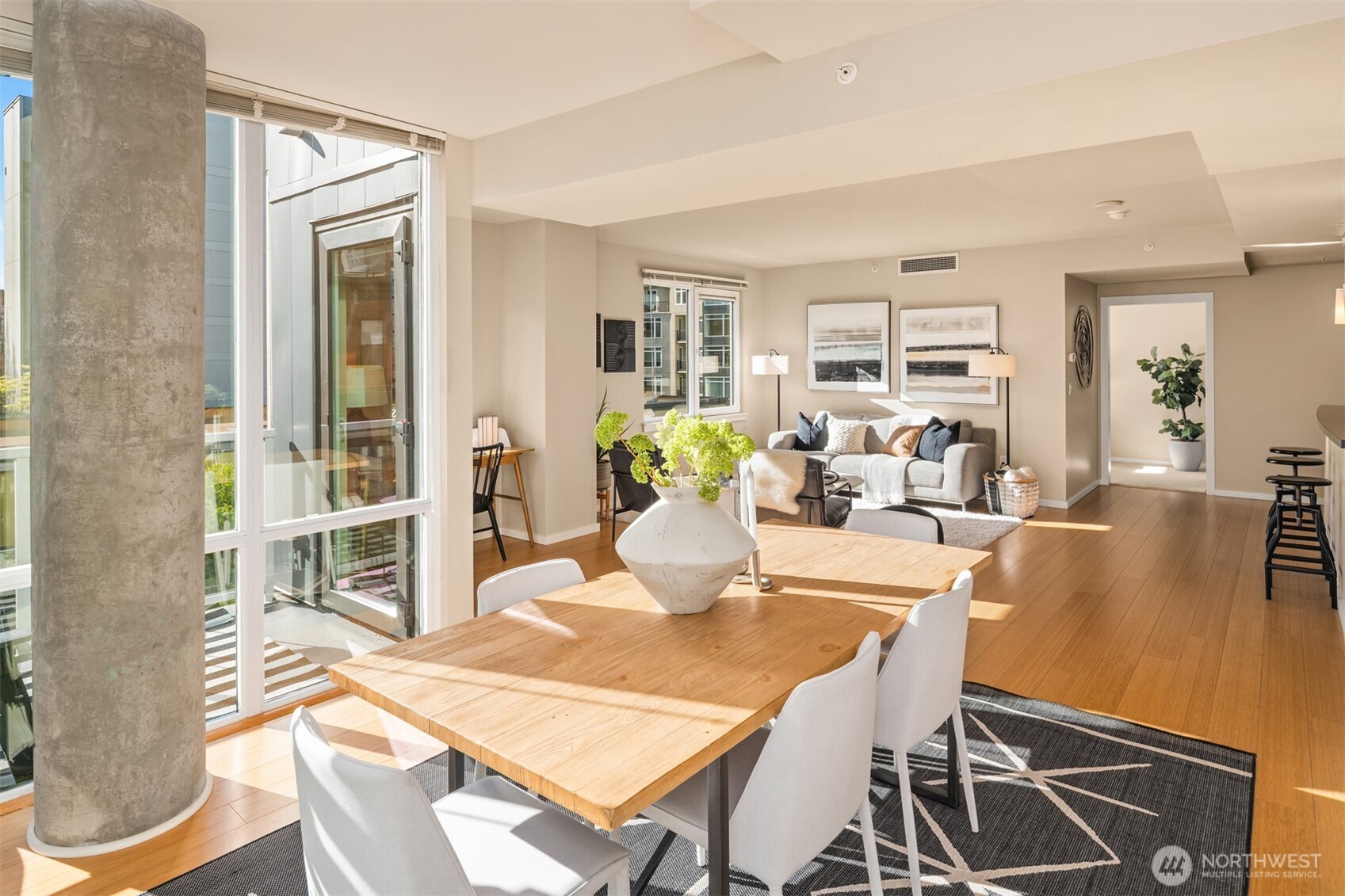 76 Cedar Street, Unit 609 Seattle, WA 98121 - Photo 1 of 31 a dining room with furniture and wooden floor