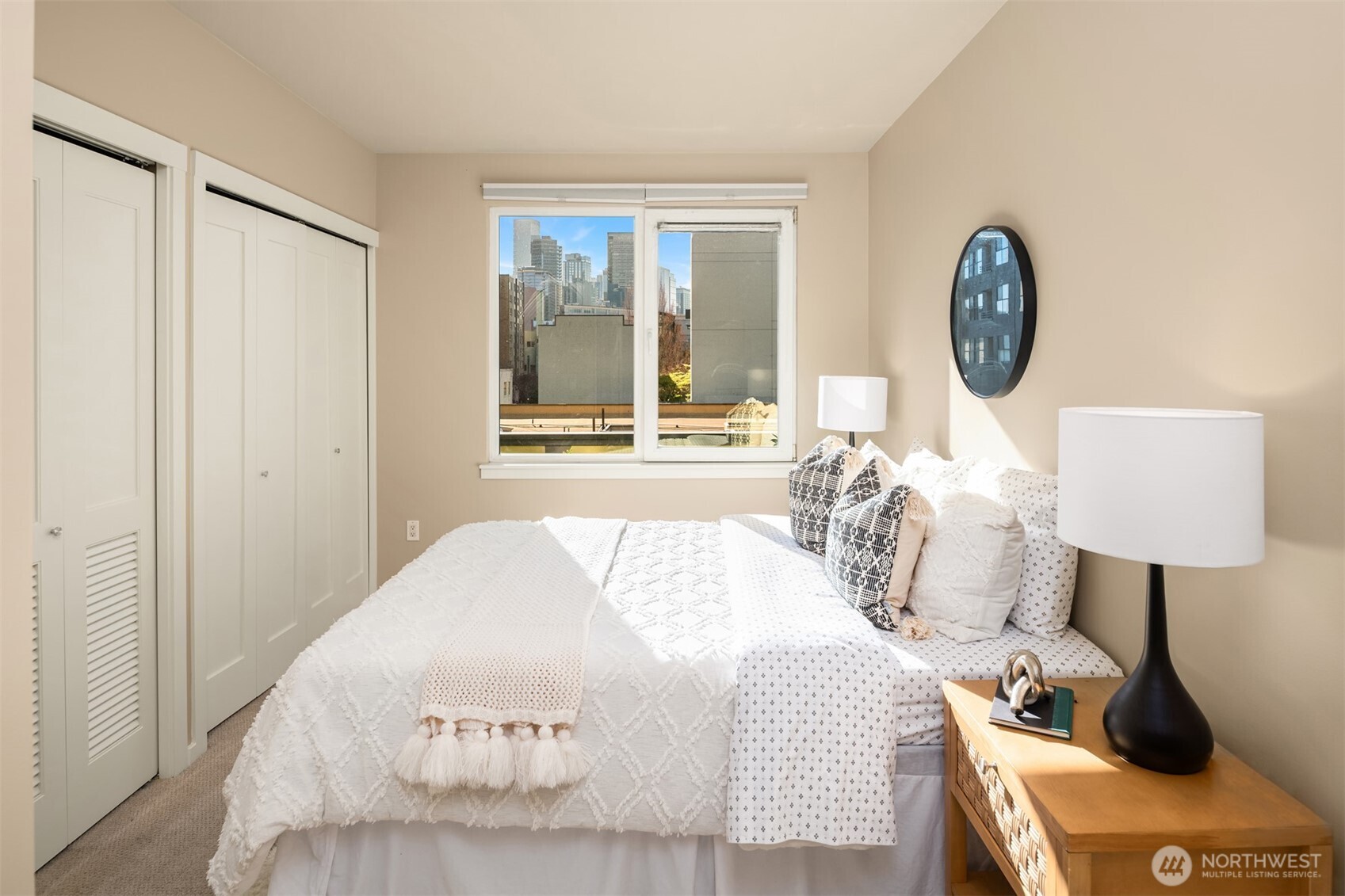 76 Cedar Street, Unit 609 Seattle, WA 98121 - Photo 19 of 31 a bedroom with a bed and a lamp on table
