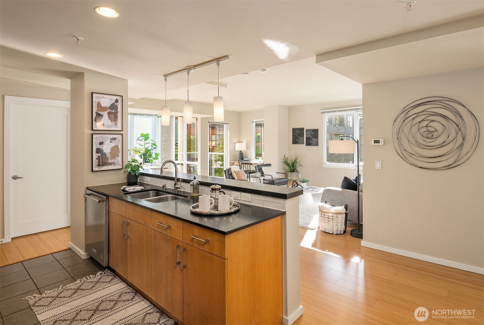 76 Cedar Street, Unit 609 Seattle, WA 98121 - Photo 5 of 31 a kitchen with a sink and a stove top oven