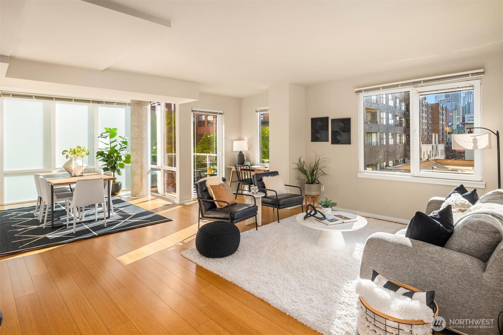 76 Cedar Street, Unit 609 Seattle, WA 98121 - Photo 9 of 31 a living room with furniture and floor to ceiling windows