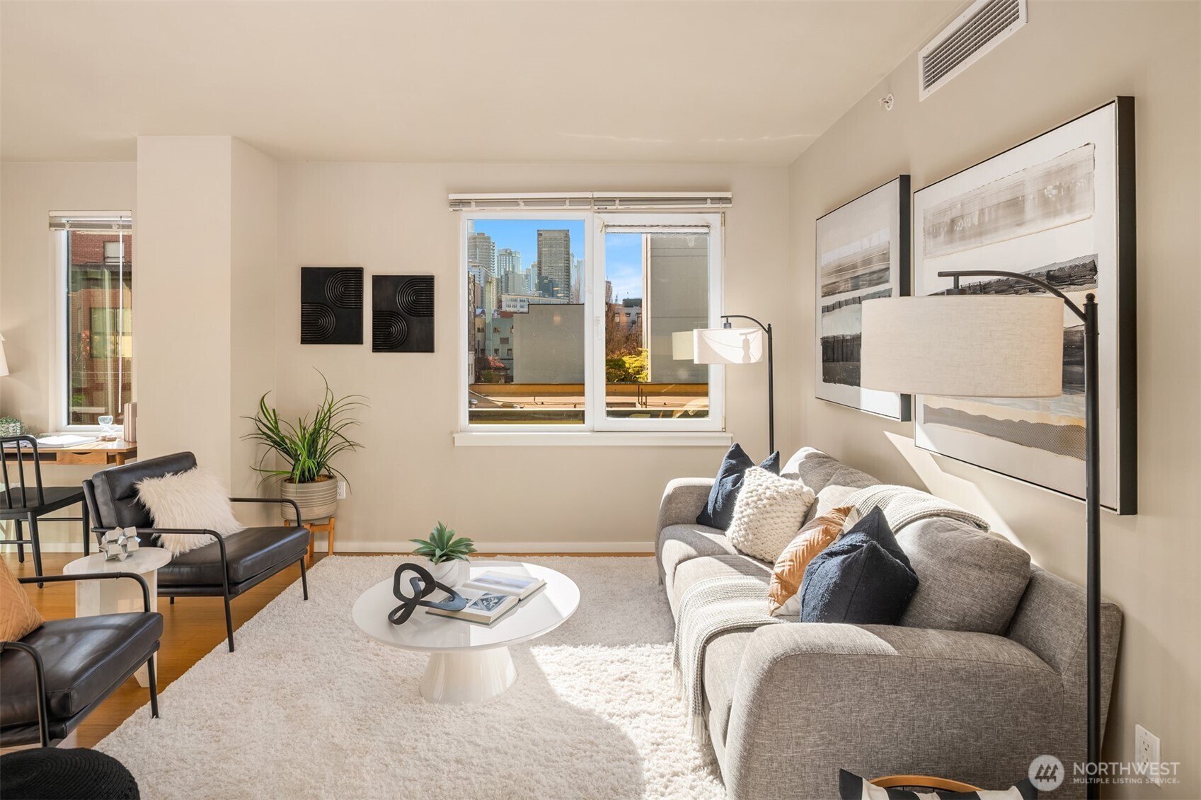 76 Cedar Street, Unit 609 Seattle, WA 98121 - Photo 10 of 31 a living room with furniture and floor to ceiling windows
