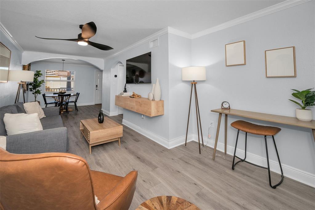 19417 Gulf Boulevard, Unit F207 Indian Rocks Beach, FL 33785 - Photo 20 of 56 a living room with furniture and a wooden floor