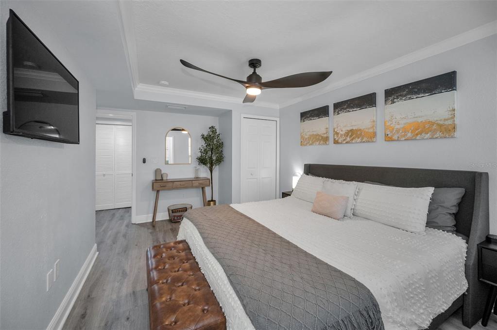 19417 Gulf Boulevard, Unit F207 Indian Rocks Beach, FL 33785 - Photo 25 of 56 a bedroom with a bed and a television