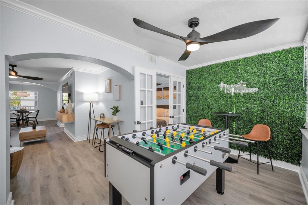 19417 Gulf Boulevard, Unit F207 Indian Rocks Beach, FL 33785 - Photo 30 of 56 a living room with furniture and a floor to ceiling window