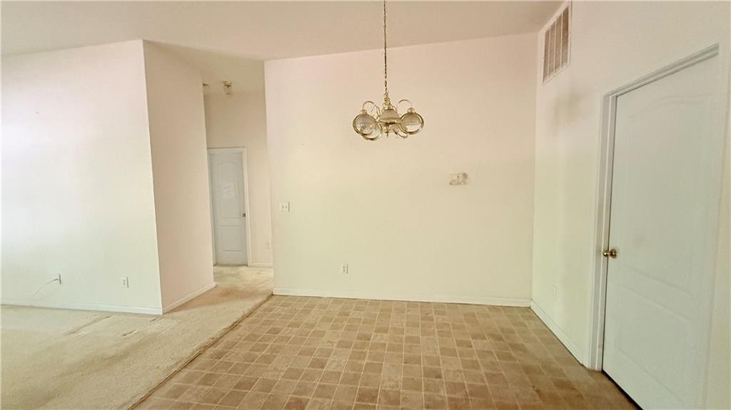 65 Lakeridge Court Covington, GA 30016 - Photo 9 of 17 a view of an empty room