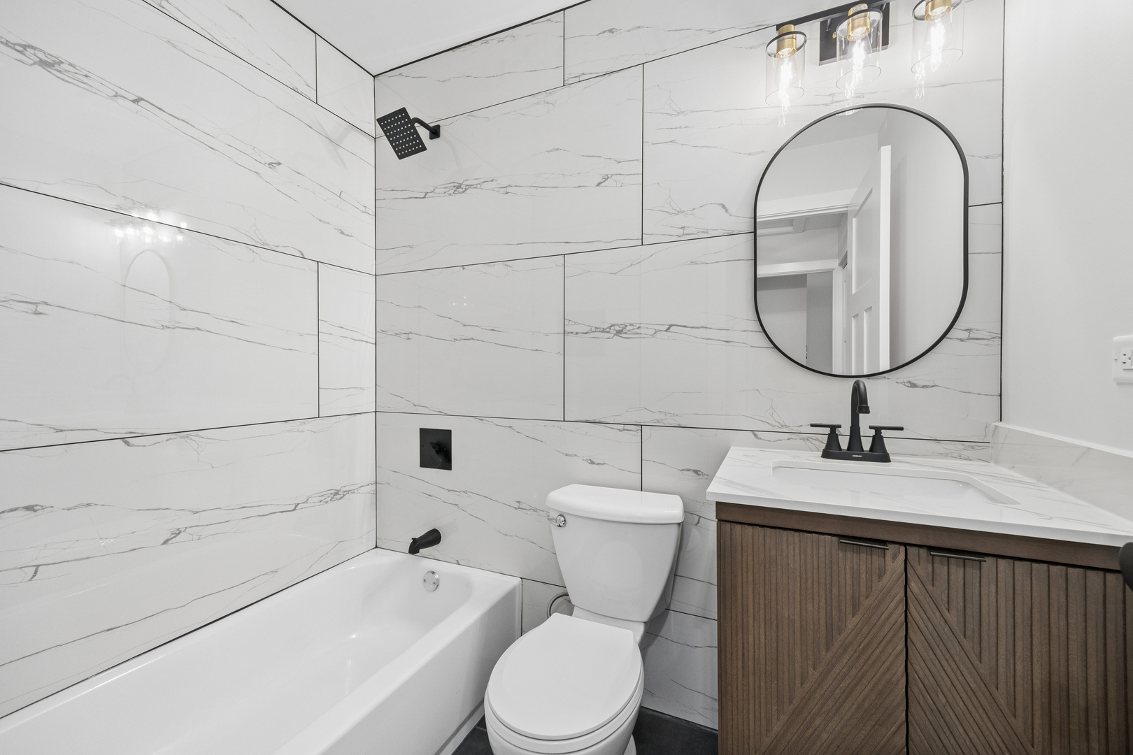 570 Andover Street Chicago Heights, IL 60411 - Photo 21 of 22 a bathroom with a sink a toilet and a mirror