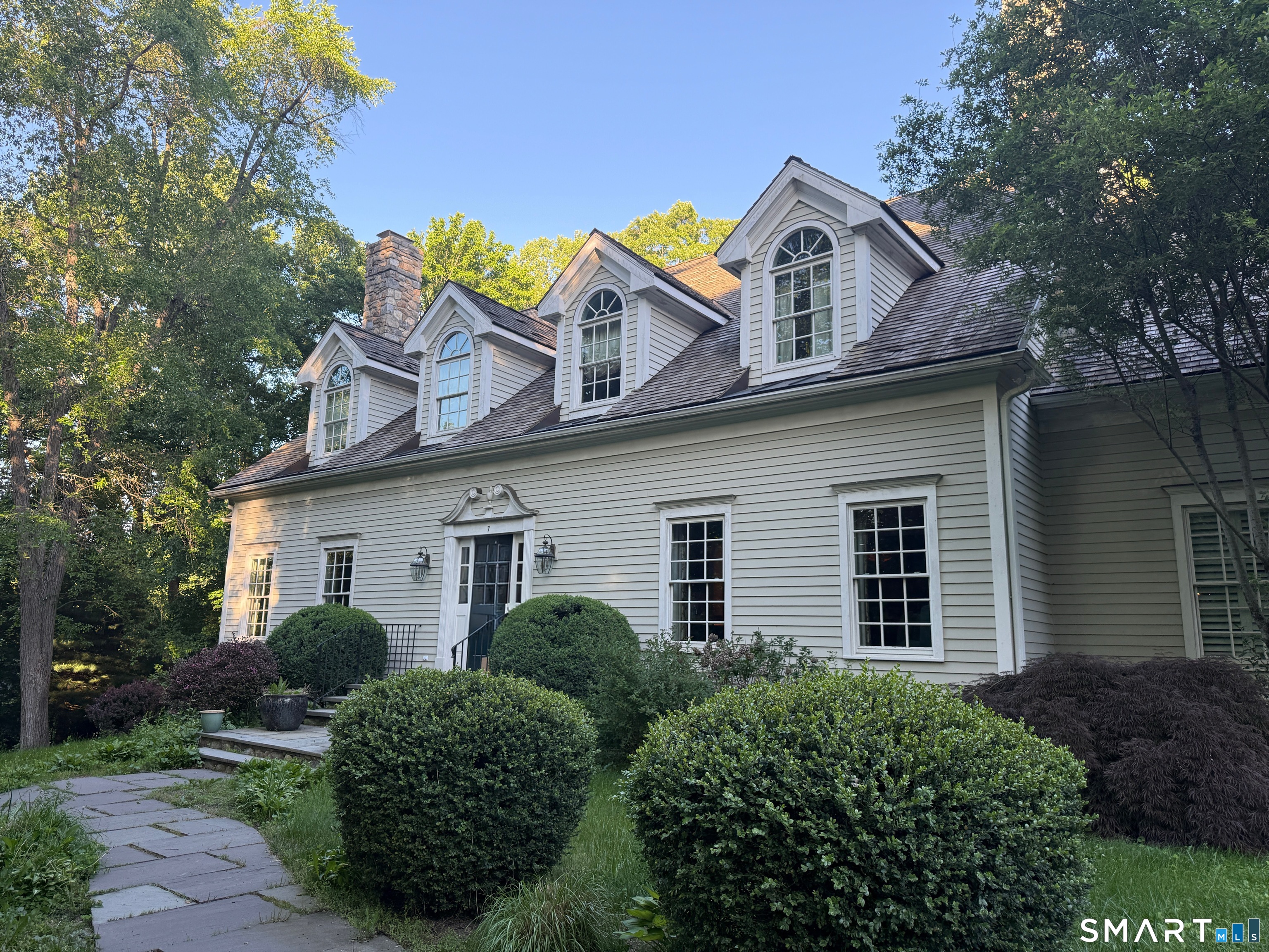 7 Old Hyde Road Weston, CT 06883 - Photo 1 of 1 a view of a house with a yard and plants