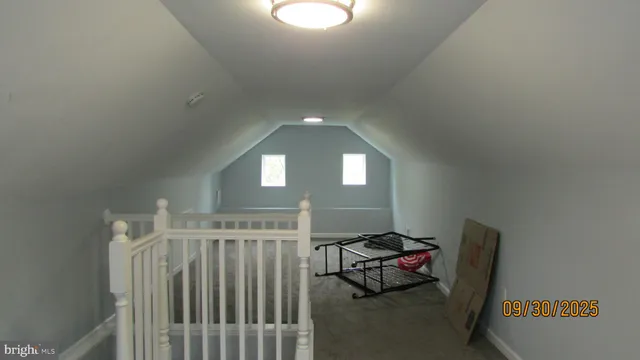 a view of staircase with white walls