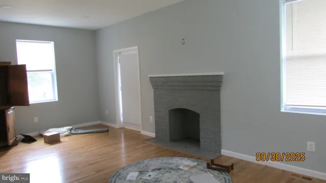 a room with a fireplace and a window