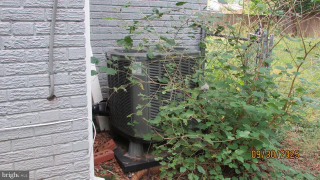 a house with lots of trees in front of it