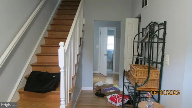 a view of staircase with wooden floor and stairs