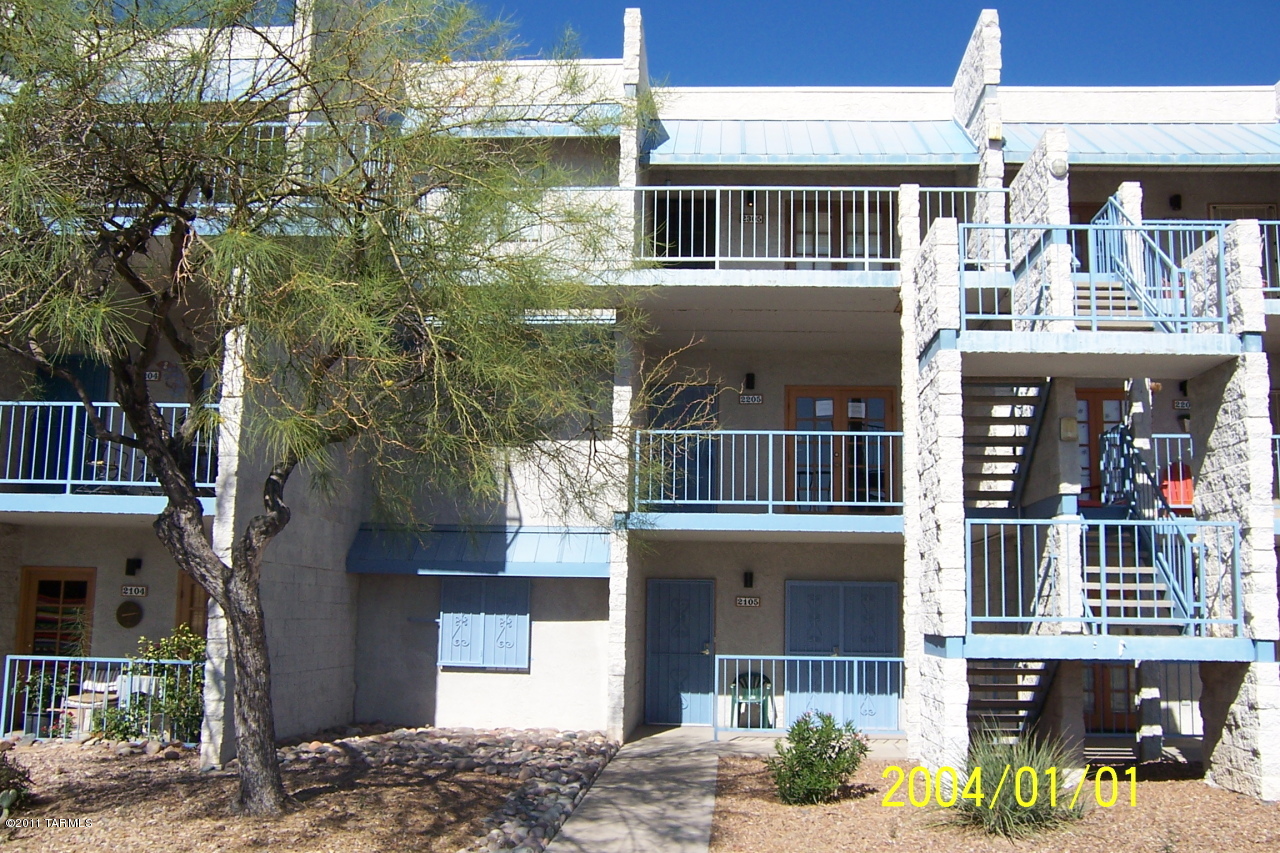 7777 East Golf Links Road, Unit 2205 Tucson, AZ 85730 - Photo 1 of 22 a front view of a house with a yard